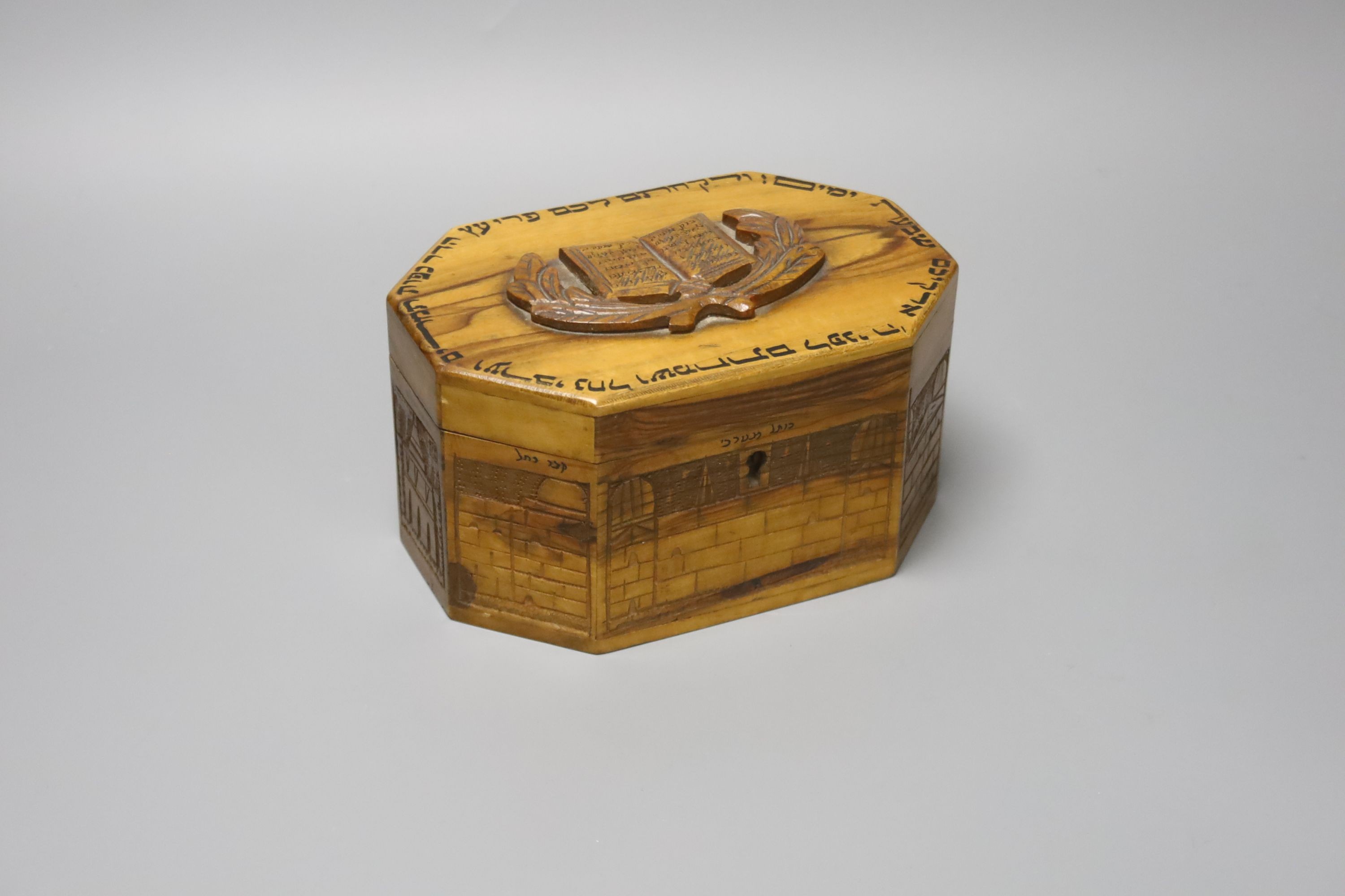 Judaica - a carved Jerusalem olivewood octagonal casket 17cm